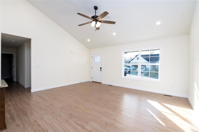 unfurnished living room with ceiling fan, light hardwood / wood-style floors, and high vaulted ceiling