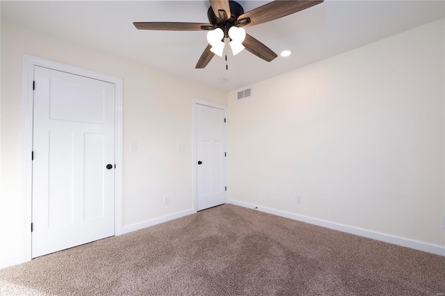 unfurnished bedroom featuring carpet and ceiling fan