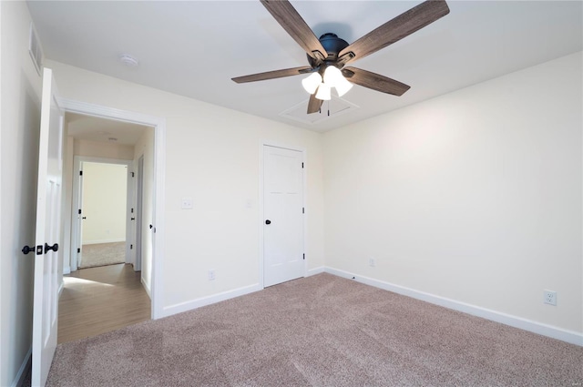 unfurnished bedroom with ceiling fan and light carpet