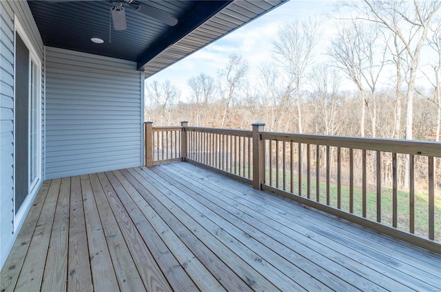 wooden deck featuring ceiling fan