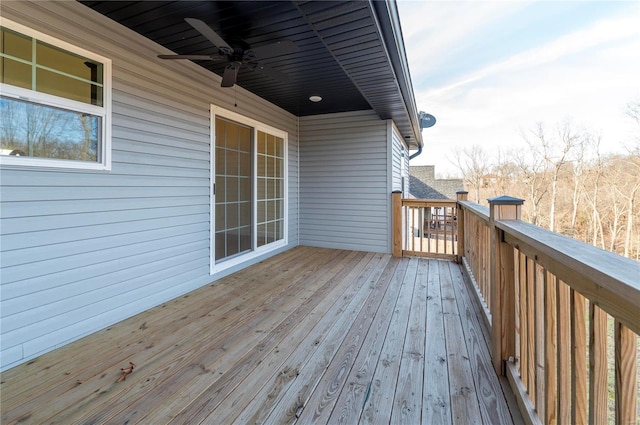 wooden terrace featuring ceiling fan