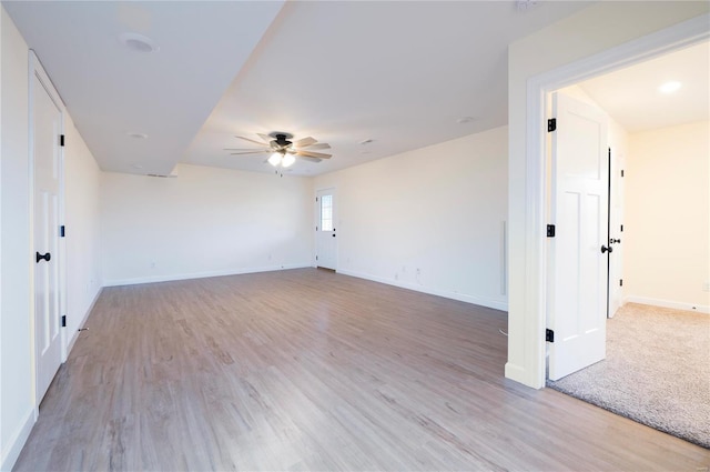 unfurnished room with ceiling fan and light hardwood / wood-style floors