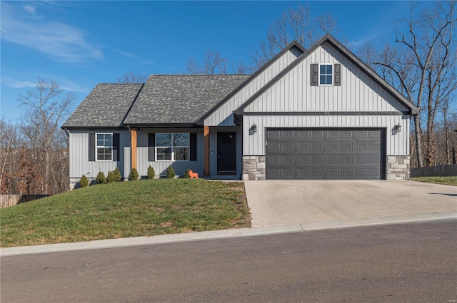 modern inspired farmhouse featuring a garage and a front lawn