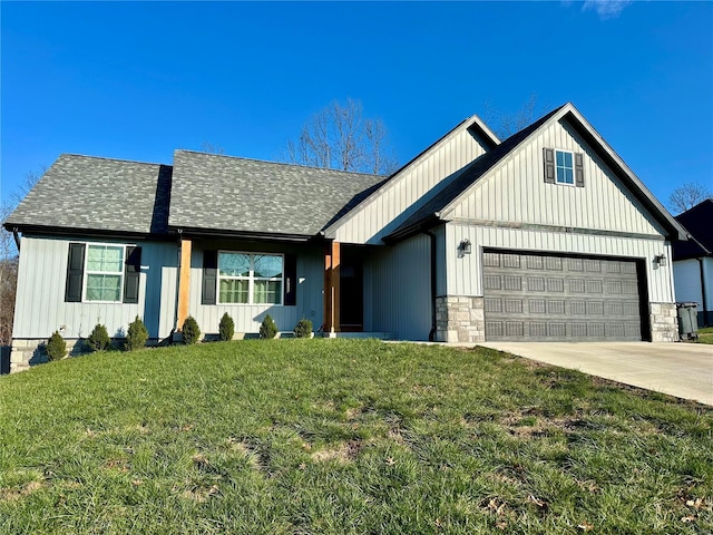 view of front of home featuring a garage and a front lawn