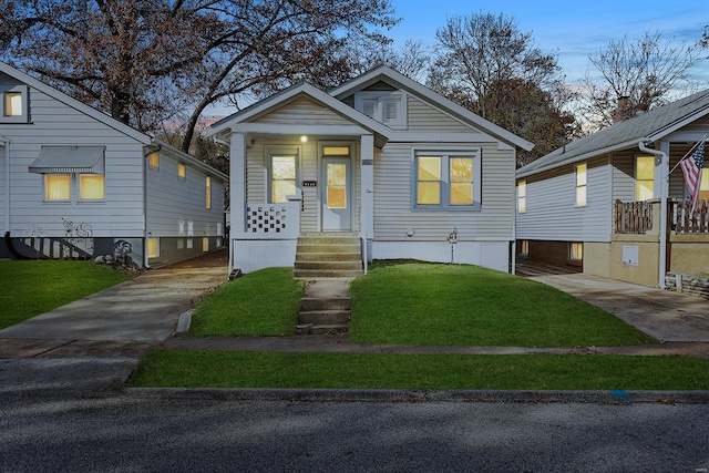 bungalow-style home featuring a lawn