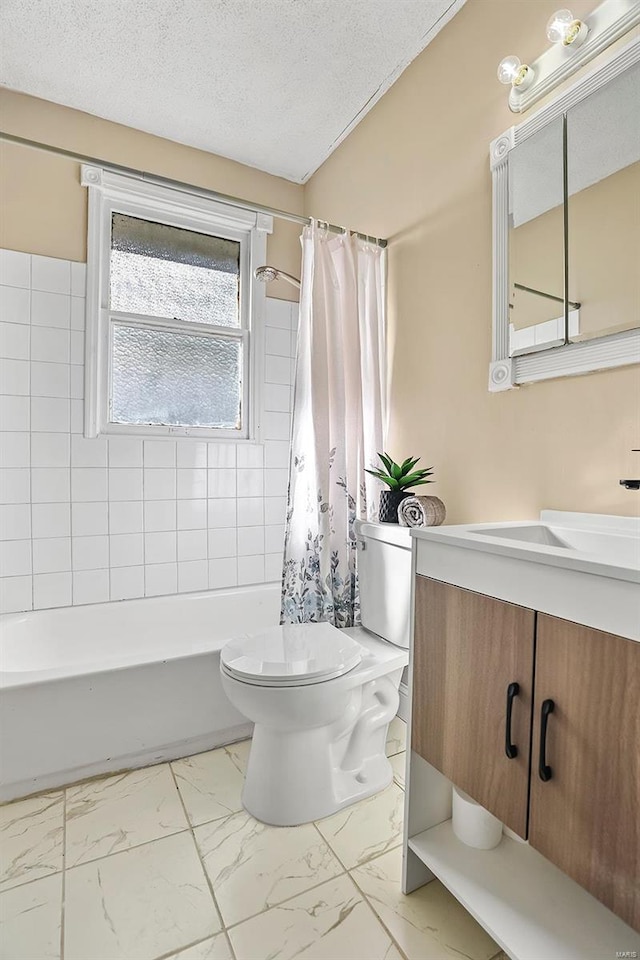 full bathroom with vanity, shower / bath combination with curtain, a textured ceiling, and toilet