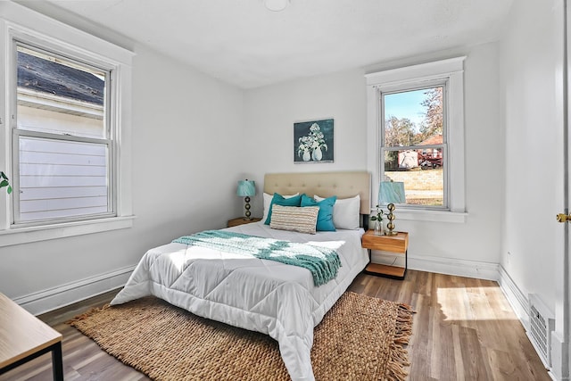 bedroom featuring wood-type flooring