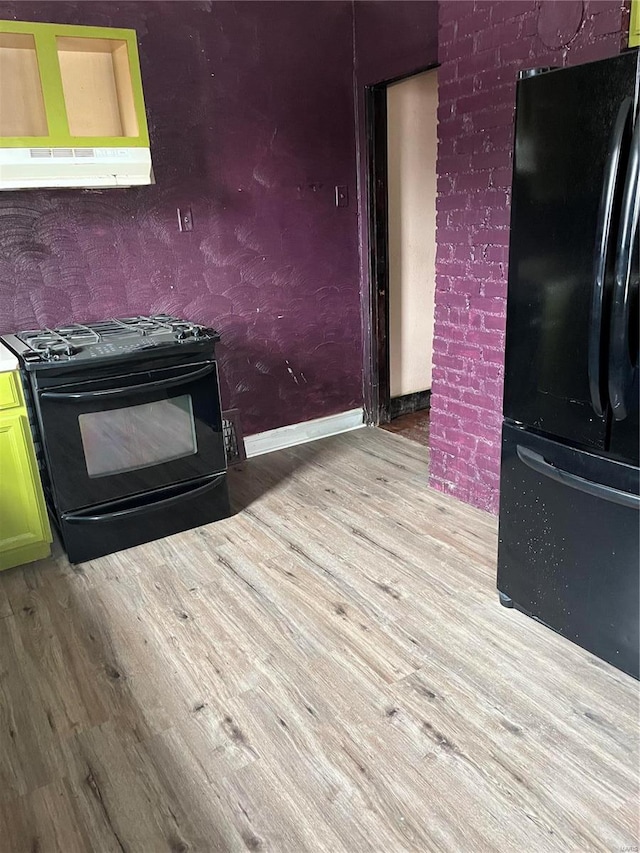 kitchen featuring ventilation hood, black appliances, and light wood-type flooring