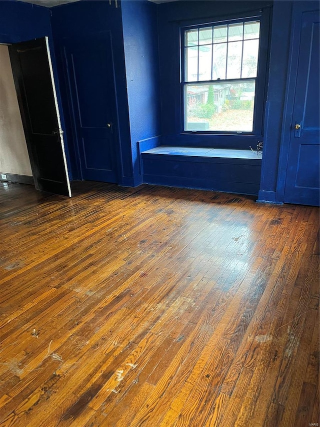 empty room featuring dark wood-type flooring