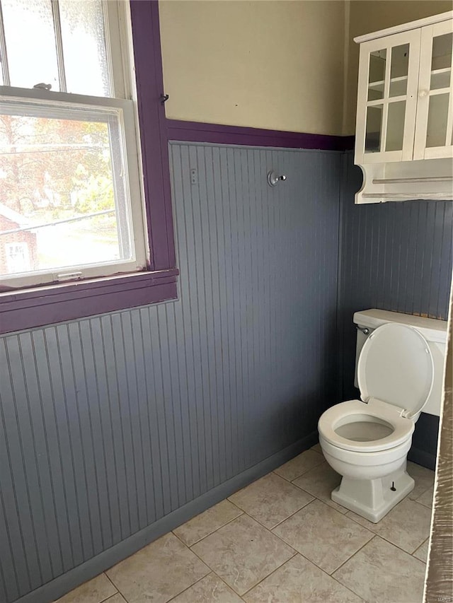 bathroom with tile patterned floors and toilet