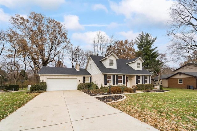 cape cod-style house featuring a front lawn and a garage