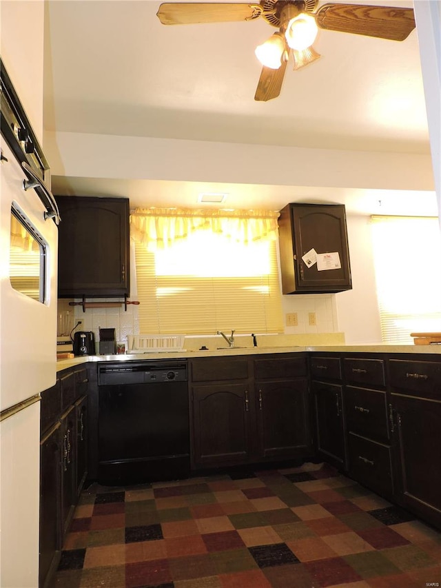 kitchen featuring dishwasher, ceiling fan, oven, and backsplash