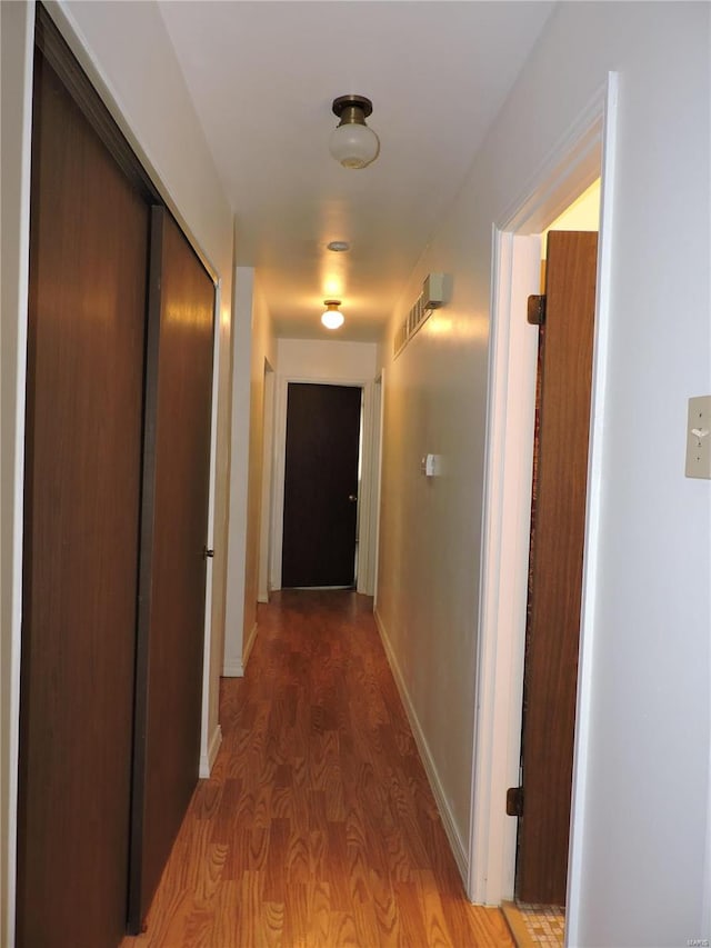 corridor featuring hardwood / wood-style flooring