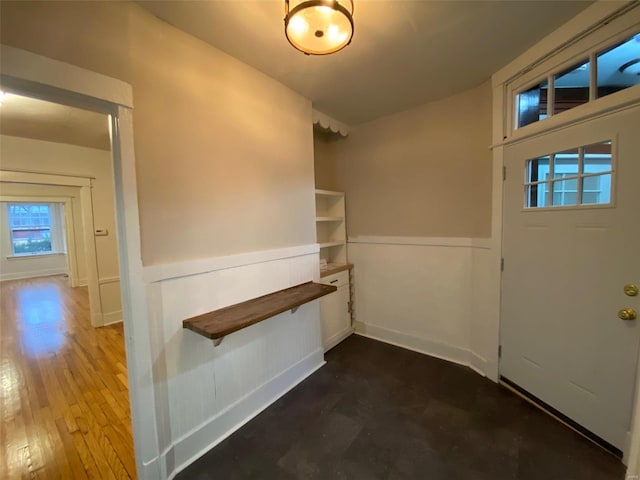 foyer entrance with hardwood / wood-style flooring