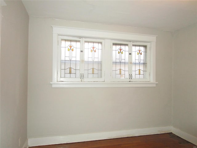 spare room featuring dark hardwood / wood-style flooring