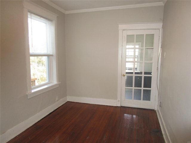 unfurnished room with plenty of natural light, dark hardwood / wood-style flooring, and crown molding