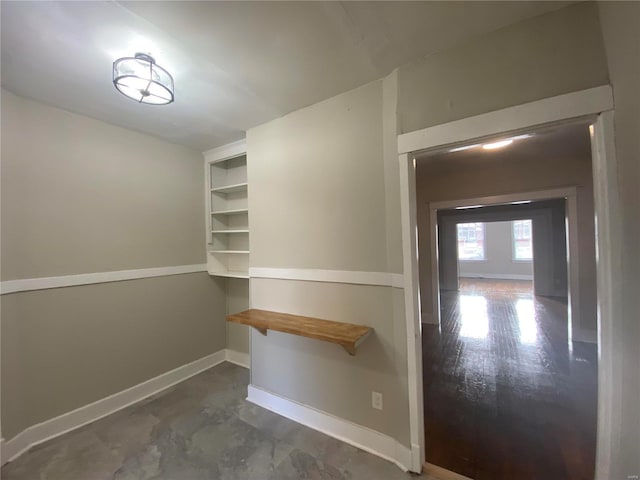 spacious closet featuring dark hardwood / wood-style flooring