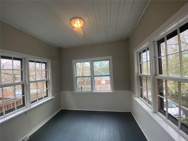 unfurnished sunroom with wood ceiling