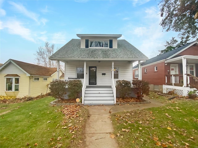 bungalow-style home featuring a front yard and a porch