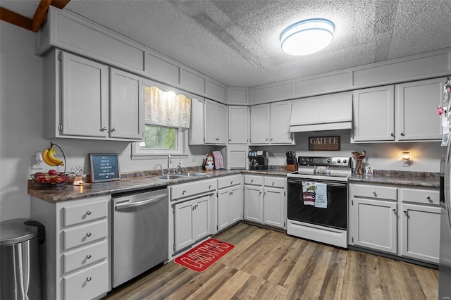 kitchen with range with electric cooktop, dishwasher, sink, dark hardwood / wood-style flooring, and white cabinets