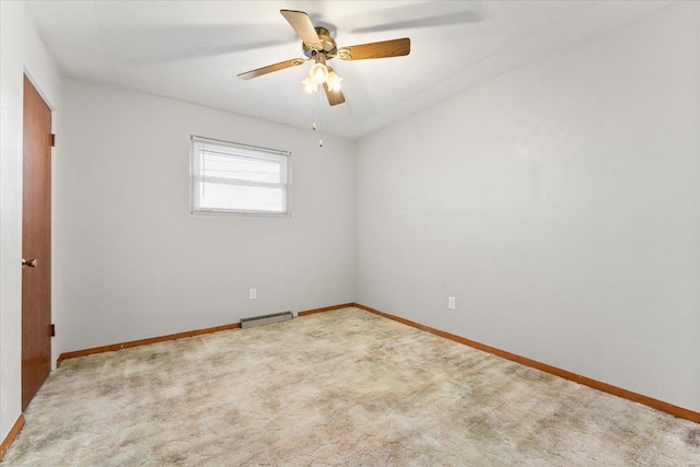 spare room featuring carpet flooring and ceiling fan