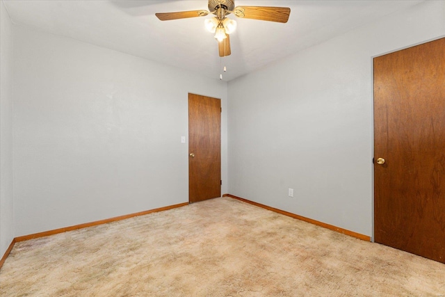 unfurnished room with ceiling fan and carpet floors