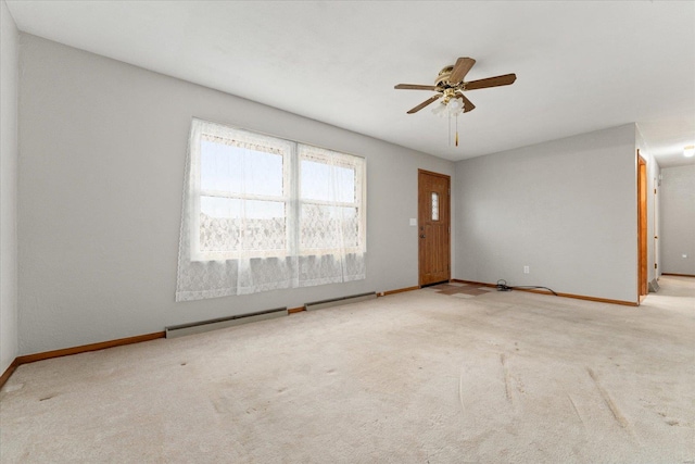 carpeted empty room featuring ceiling fan