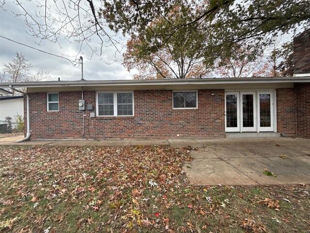 back of house with a patio