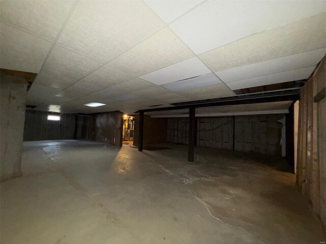 basement featuring a drop ceiling