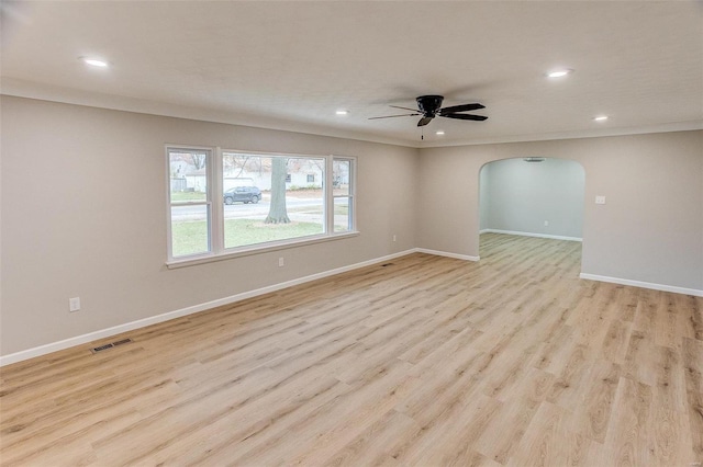 unfurnished room with light wood-type flooring and ceiling fan