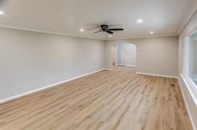 unfurnished room featuring light hardwood / wood-style flooring, ceiling fan, and crown molding