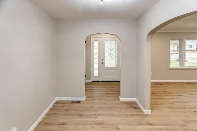 foyer entrance with light hardwood / wood-style flooring