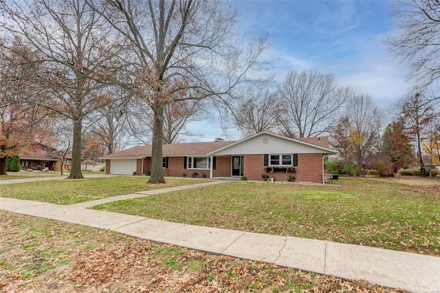 view of front of home with a garage and a front lawn