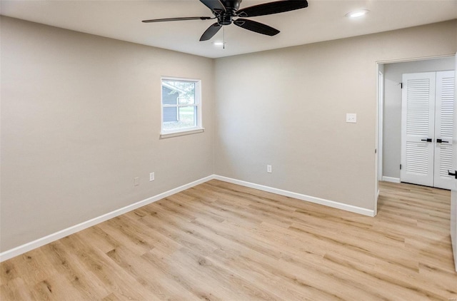 unfurnished room featuring ceiling fan and light hardwood / wood-style floors