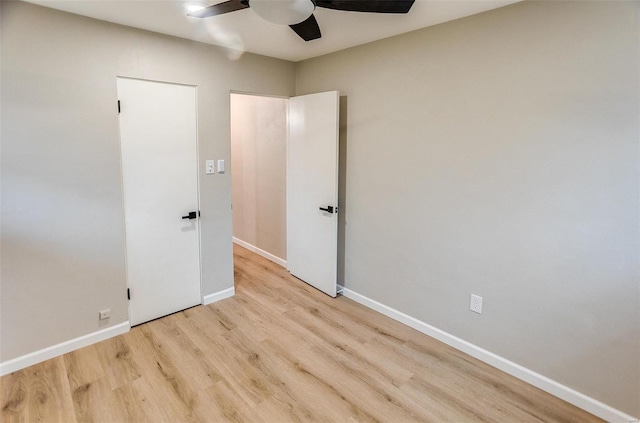 unfurnished room featuring ceiling fan and light hardwood / wood-style floors