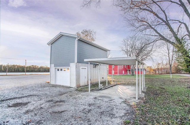 view of property exterior with a carport and a garage