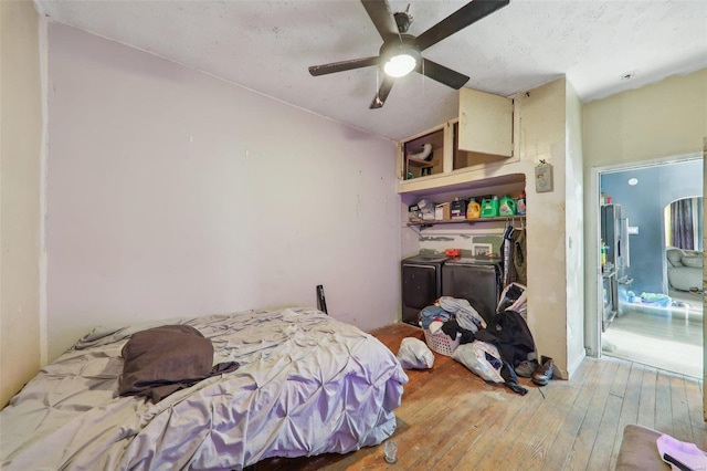 bedroom featuring hardwood / wood-style flooring and ceiling fan