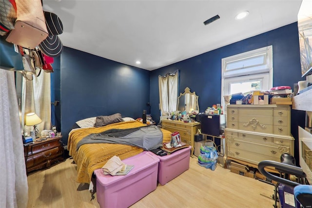 bedroom featuring hardwood / wood-style floors