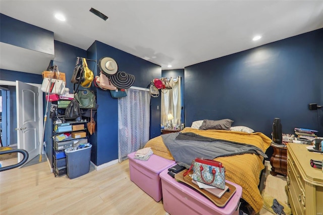 bedroom with light hardwood / wood-style floors