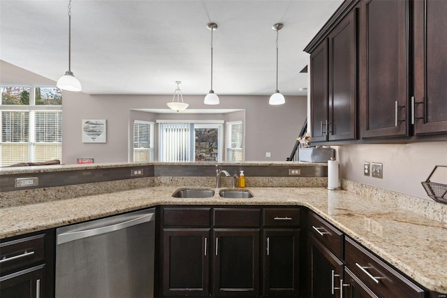 kitchen featuring stainless steel dishwasher, decorative light fixtures, dark brown cabinetry, and sink