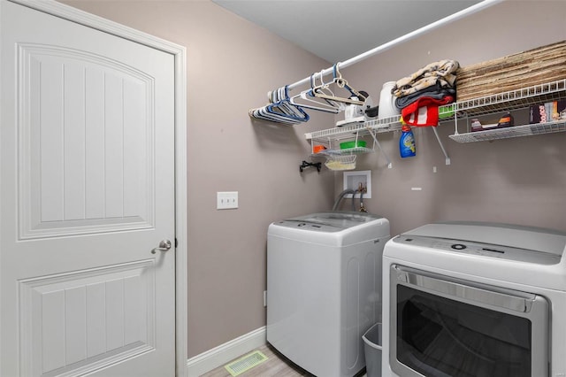 laundry area featuring separate washer and dryer