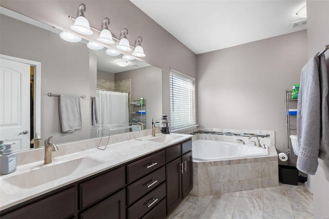 bathroom with vanity and independent shower and bath