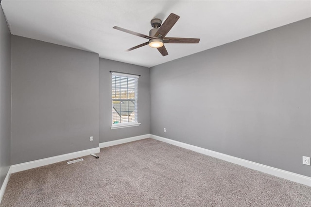 unfurnished room featuring carpet and ceiling fan