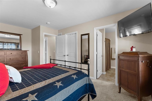 bedroom with light colored carpet