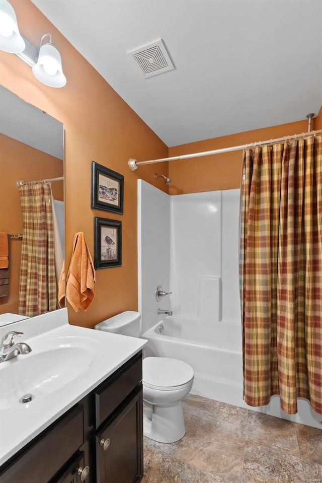 full bathroom with toilet, vanity, and shower / tub combo with curtain