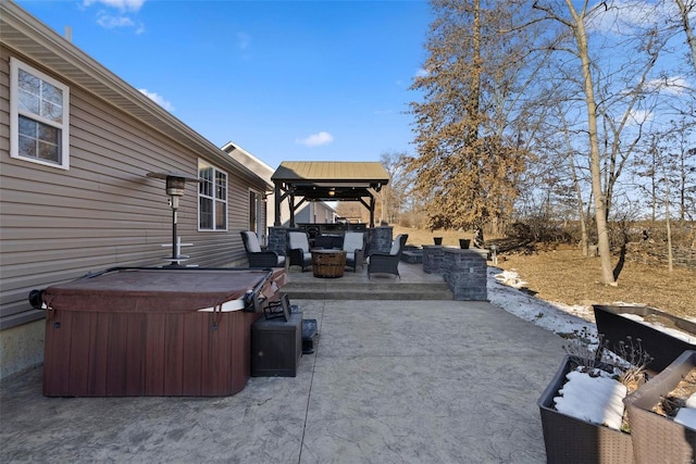 view of patio / terrace featuring an outdoor living space, a gazebo, and a hot tub