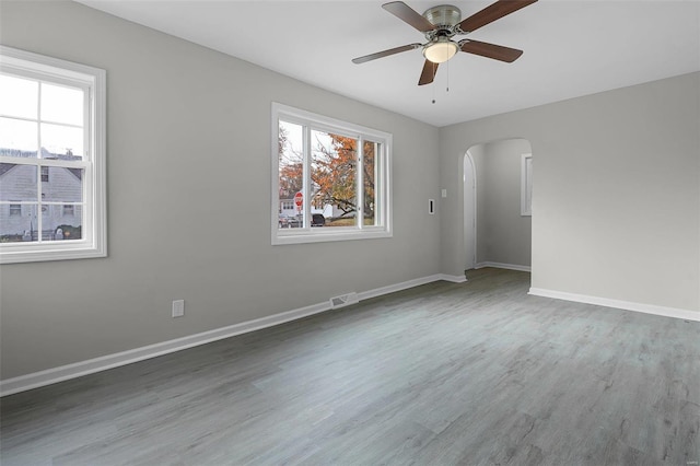 unfurnished room featuring ceiling fan and hardwood / wood-style floors