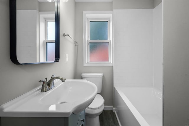 full bathroom with vanity, wood-type flooring, tub / shower combination, and toilet