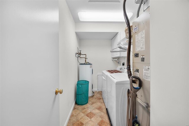 clothes washing area with electric water heater and separate washer and dryer