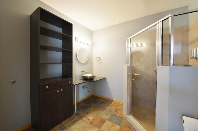 bathroom with vanity and an enclosed shower